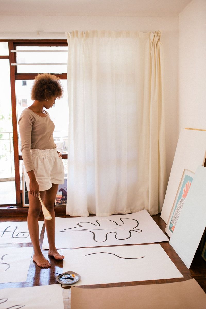 woman painting art at home